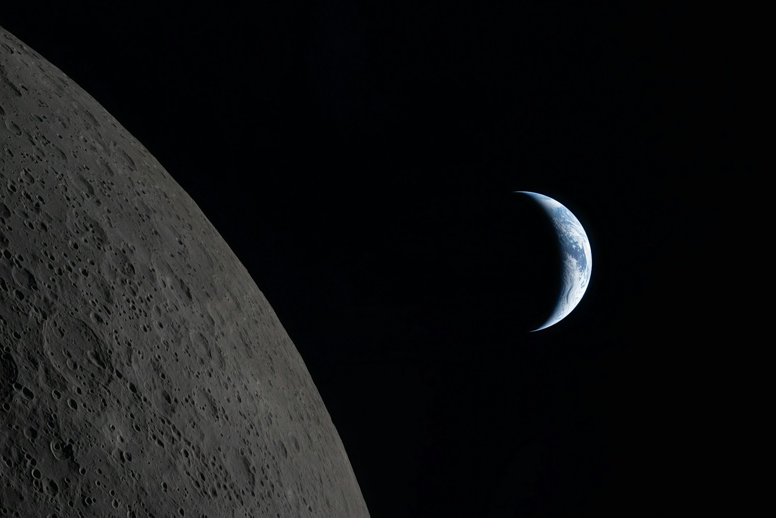 Crescent earth seen from the moon's surface