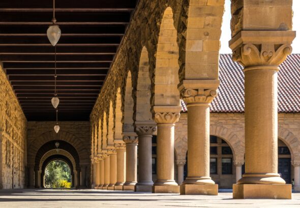 brown concrete hallways with columns